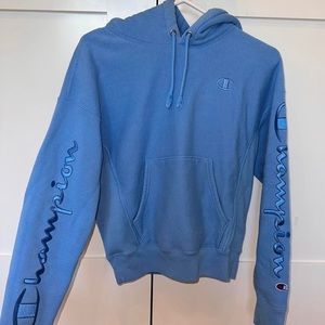 Champion reverse weave blue hoodie w/ logo stitching embroidered on sleeves